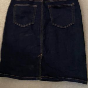 Denim skirt. Above knee.
